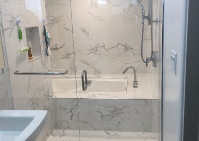 Frameless Shower Enclosure Example with marble bath tub
