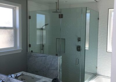 california frameless glass shower door installation in with marble walls with custom design